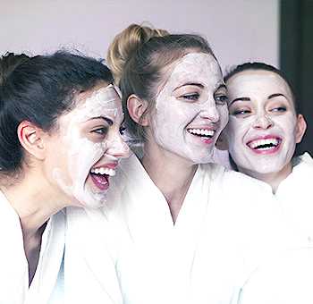 Women relaxing and enjoying massage therapy.