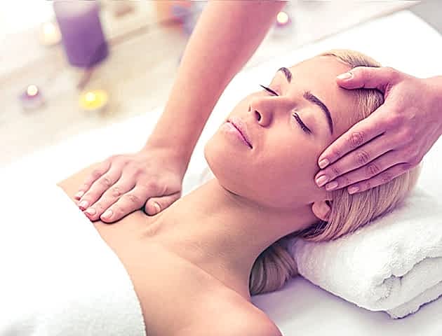 Woman being massaged by a therapist.