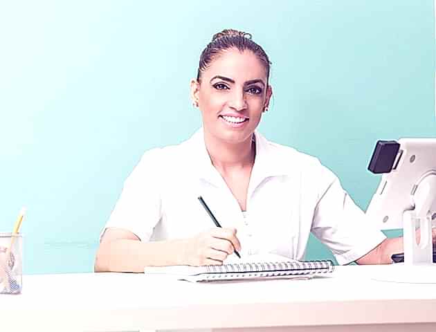 Massage therapists managing Planfy booking system.