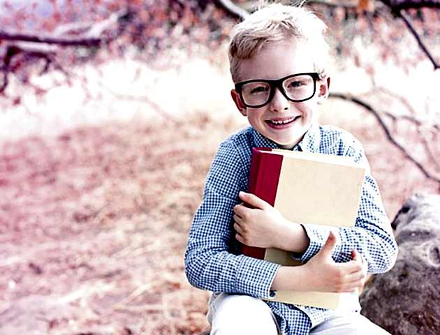 Smiling boy wearing new prescription glasses.